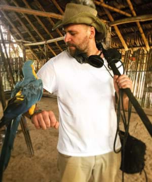 Michal Deliopulos with a parrot and a panamic